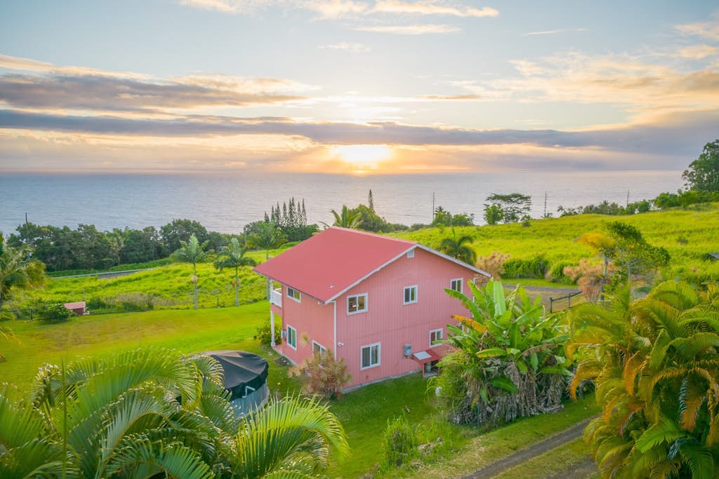 Spectacular two-story ocean-view home on two acres with covered lanai