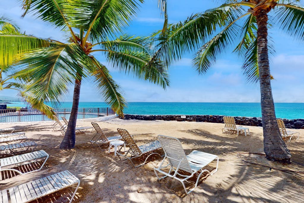Waterfront condo with shared pools, private beach, balcony,  W/D, and AC