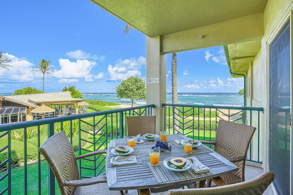 Oceanfront luxury steps from the beach with pool, hot tub, balcony & central AC