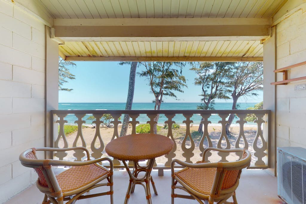Top-floor beach condo with sweeping oceanfront views - steps to pool & hot tub