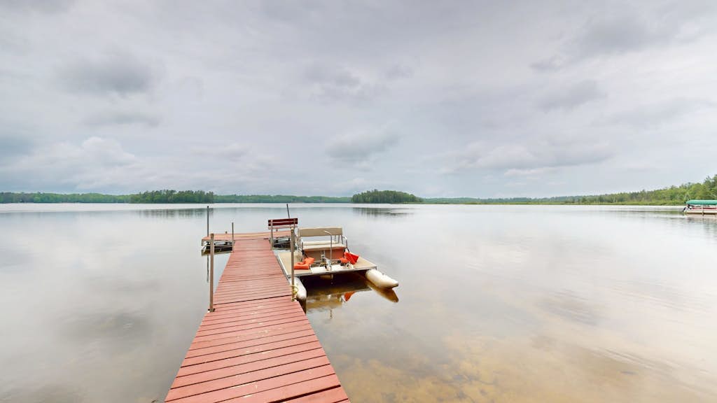 Lakefront home with, dock, kayaks, paddle boards, fire pit & more