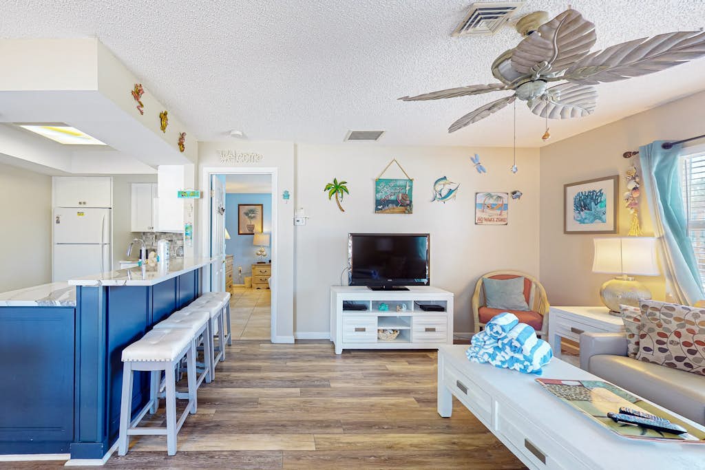 Ground-floor home with fast WiFi, shared pool, & central AC - close to beach