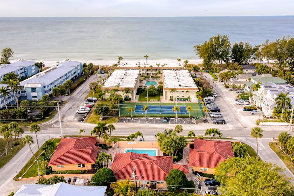 Ground-floor home with fast WiFi, shared pool, & central AC - close to beach
