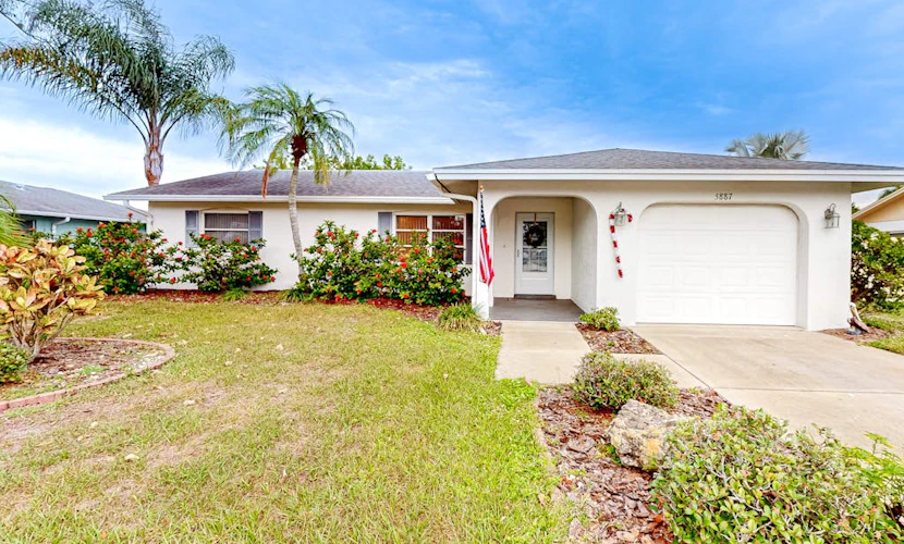 Single-story home with private yard, enclosed patio, updated interior, & W/D