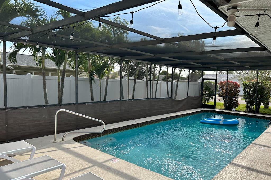 Updated home near beach with heated pool, lanai, WiFi, W/D & AC - great location