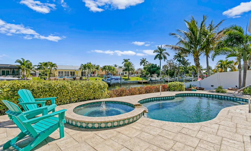 Canal front home with boat access and and private pool and spa with fountain