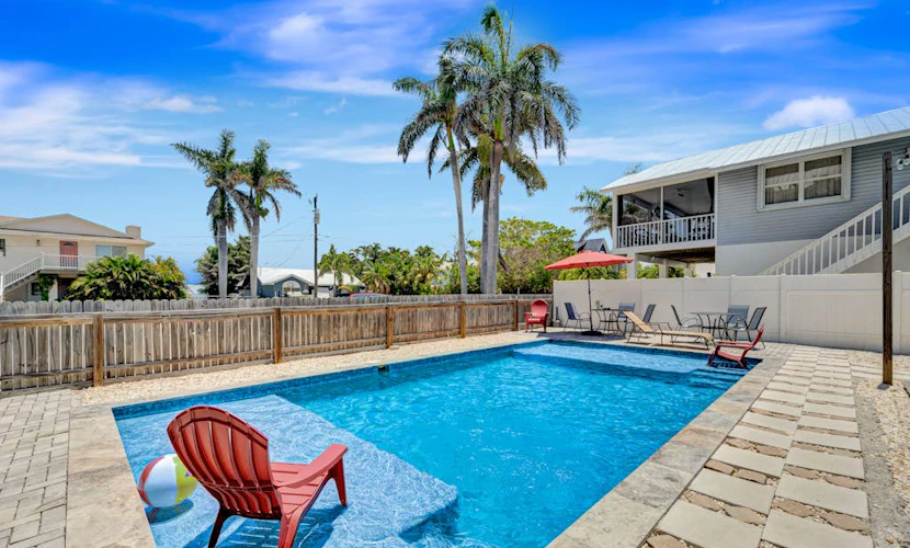 2nd-floor duplex near beach with heated pool, grill, balcony, & W/D