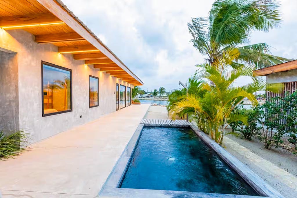 Relaxing tropical villa with private plunge pool, open layout & canal water view