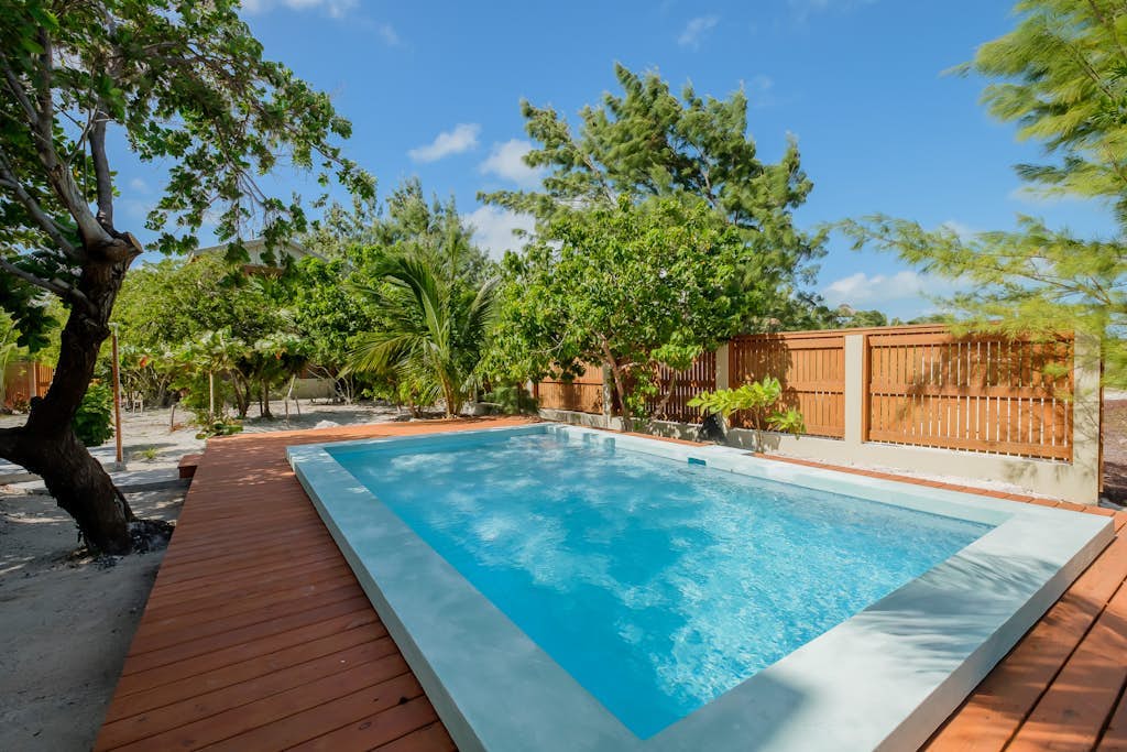 Beachfront abode with well-equipped kitchen - pool, beach, grill, & canoe access