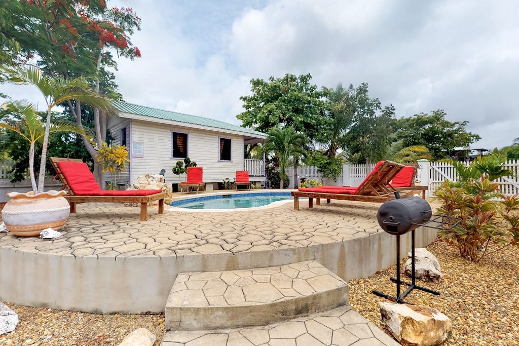 Cabana with WiFi and a shared pool, patio area, and grill - walk to the beach