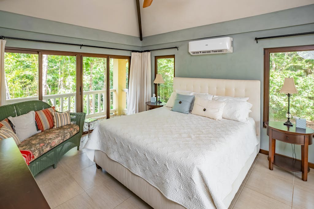 Set within Red Rock, formerly known as The Reserve / Sanctuary Bay, this two-bedroom home offers a quiet tropical setting with access to the community Beach Club and shared pool. With a king bedroom, queen bedroom, full kitchen, WiFi, and space for four, it’s a comfortable base for couples, friends, or small families exploring southern Belize.