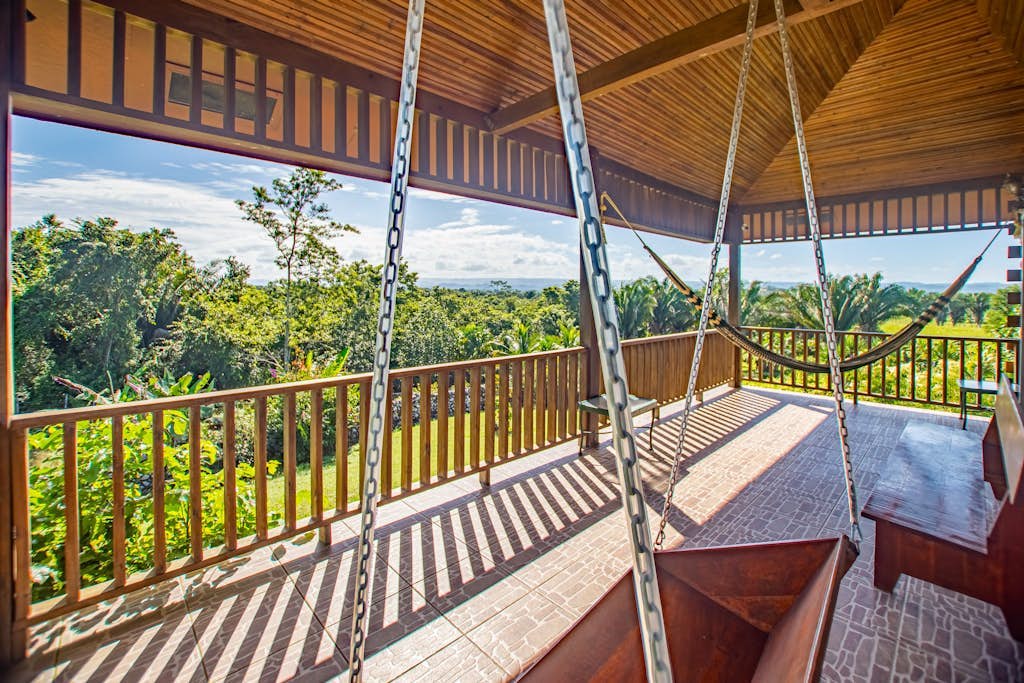 Charming cabin with private balcony, lush views & eco-friendly features