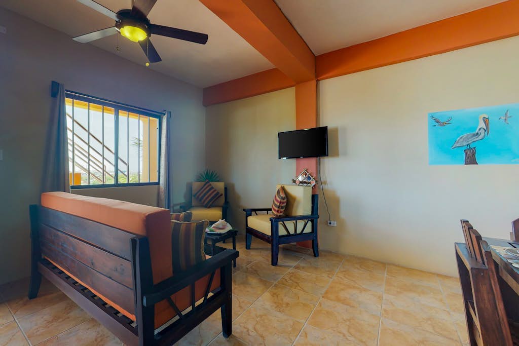 Inviting apartment w/ ocean views, a shared rooftop, laundry, WiFi & partial AC