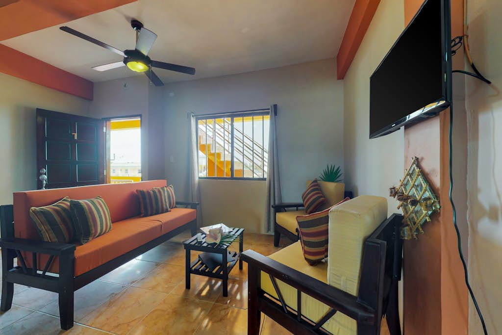 Inviting apartment w/ ocean views, a shared rooftop, laundry, WiFi & partial AC