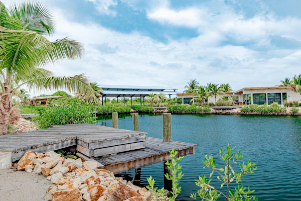 Unwind at this modern waterfront villa in Seabird, where a private splash pool, private dock, and spacious indoor-outdoor living create the perfect setting for your Placencia getaway. With four bedrooms, room for up to eight guests, and access to Seabird's community pool and café, it's an inviting retreat for families and friends exploring Belize.