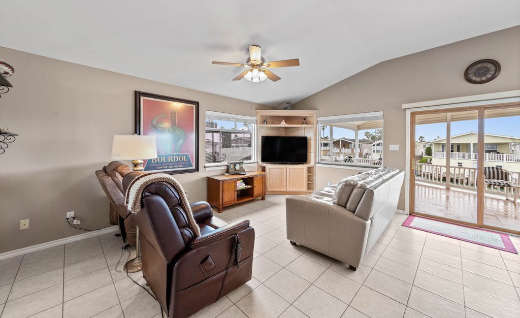 Welcome to Coastal Canal Cottage, a single-level waterfront escape on a quiet canal in Port Isabel's gated Long Island Village. Sip coffee on the covered deck as the breeze rolls in, cast a line from the dock out front, then come inside to a bright open living space with a granite kitchen and water views. With a king primary, a queen guest room, and resort pools, golf, and tennis just across the way, this is easy Gulf Coast living. Book your canal-front getaway.