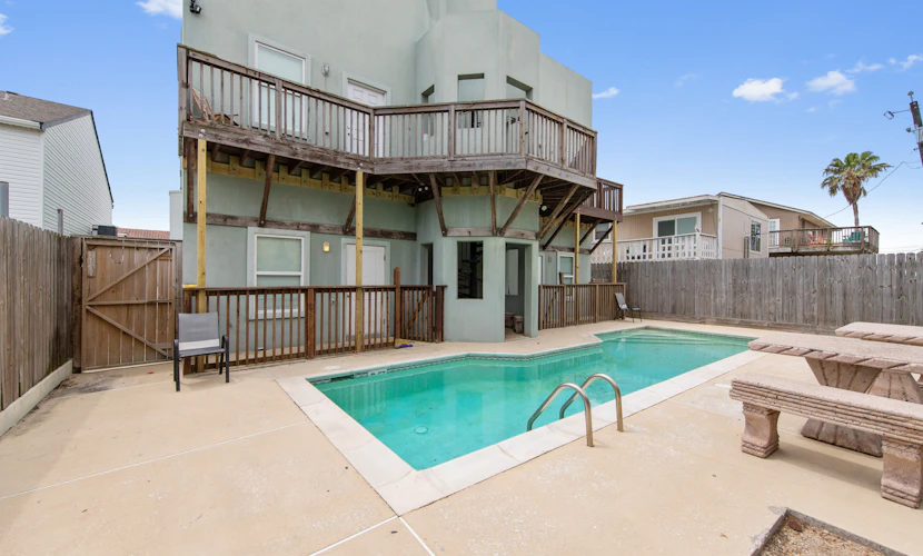 Welcome to Island Dream, a bright three-story retreat on the Gulf side of South Padre Island, just a short walk to the beach. Three bedrooms and three full baths give everyone room to spread out, the open living and kitchen invite easy meals, and the shared pool out back is perfect on warm Texas days. Soak in the primary suite garden tub, catch the breeze on the deck, and let the island set the pace. Sun, sand, and slow mornings start right here.