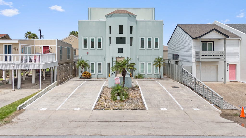 Welcome to Island Dream, a bright three-story retreat on the Gulf side of South Padre Island, just a short walk to the beach. Three bedrooms and three full baths give everyone room to spread out, the open living and kitchen invite easy meals, and the shared pool out back is perfect on warm Texas days. Soak in the primary suite garden tub, catch the breeze on the deck, and let the island set the pace. Sun, sand, and slow mornings start right here.