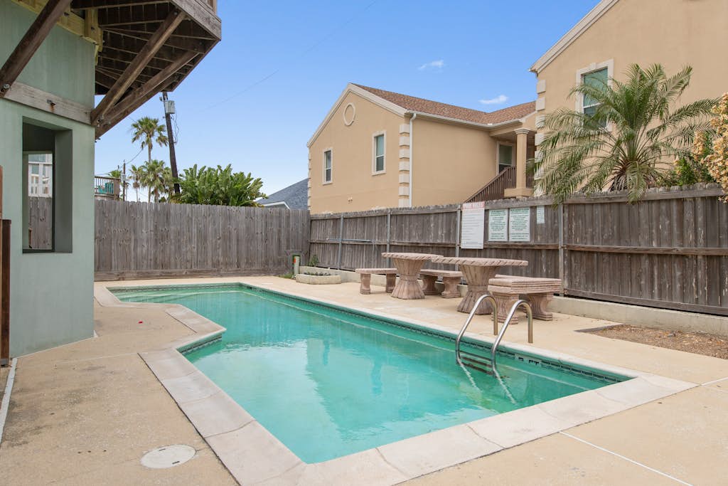 Welcome to Island Dream, a bright three-story retreat on the Gulf side of South Padre Island, just a short walk to the beach. Three bedrooms and three full baths give everyone room to spread out, the open living and kitchen invite easy meals, and the shared pool out back is perfect on warm Texas days. Soak in the primary suite garden tub, catch the breeze on the deck, and let the island set the pace. Sun, sand, and slow mornings start right here.