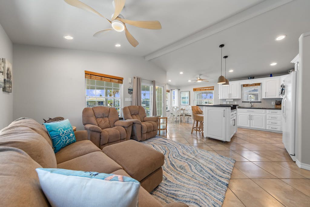 Welcome to 289 Sundial Circle, a single-level waterfront home on the channel in the gated Long Island Village resort near Port Isabel. Sip coffee on the covered deck as the water glides by, then gather in the open living, kitchen, and dining space. A king primary suite and a queen guest room rest your group in comfort. Dive into the resort pools, play the 18-hole golf course, or cross the causeway to South Padre Island beaches in minutes. Your easygoing Gulf Coast escape starts here.