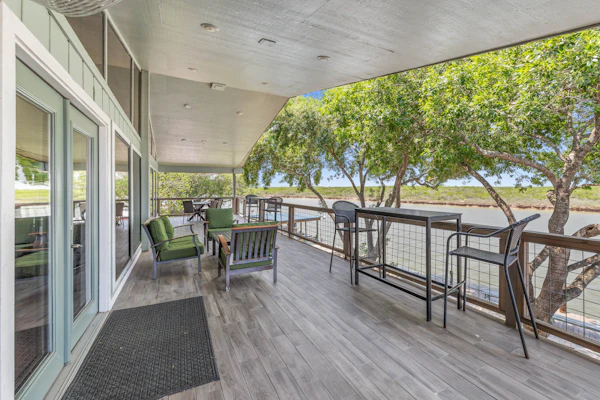 Welcome to the Upper Level of Casa Arroyo Sporting Lodge, the prime spot on the water in Arroyo City. Five bedrooms and four baths sleep up to 14, with an elevator for easy access and a wide covered balcony overlooking the arroyo and wildlife refuge. Watch boats and barges drift by, cast from the lighted pier, gather in the open great room and bar, and cook in the full kitchen. You are minutes from world-class bay fishing and the Laguna Atascosa refuge.
