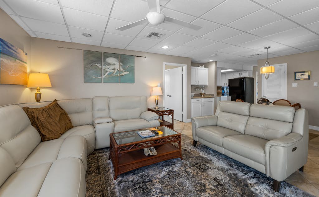 Welcome to Galleon's Getaway, a breezy bayfront condo on South Padre Island. Watch calm Laguna Madre water from your wraparound balcony, sip morning coffee in the salt air, and fire up the grill as the sun drops over the bay. Inside, an open living space, full kitchen, and two bedrooms sleep four. The shared pool and hot tub sit steps away, and the Gulf beaches are a short trip across the island. Made for longer stays, it is an easy place to settle in for a month or a season on the water.