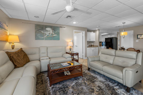 Welcome to Galleon's Getaway, a breezy bayfront condo on South Padre Island. Watch calm Laguna Madre water from your wraparound balcony, sip morning coffee in the salt air, and fire up the grill as the sun drops over the bay. Inside, an open living space, full kitchen, and two bedrooms sleep four. The shared pool and hot tub sit steps away, and the Gulf beaches are a short trip across the island. Made for longer stays, it is an easy place to settle in for a month or a season on the water.