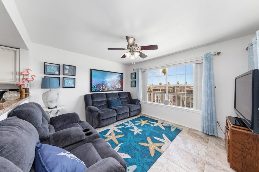 Welcome to Lazy Days Sea Cottage, a two-story canal-front retreat in Port Isabel's gated Long Island Village. Take in the water from the upstairs deck, watch the boats drift along the canal, and gather in a bright, beachy living space with a full kitchen. A king primary suite tops the home, and a family bunk room sleeps the kids, with room for six in all. Resort pools, golf, and tennis are steps away, and South Padre Island beaches are a ten-minute drive over the causeway.