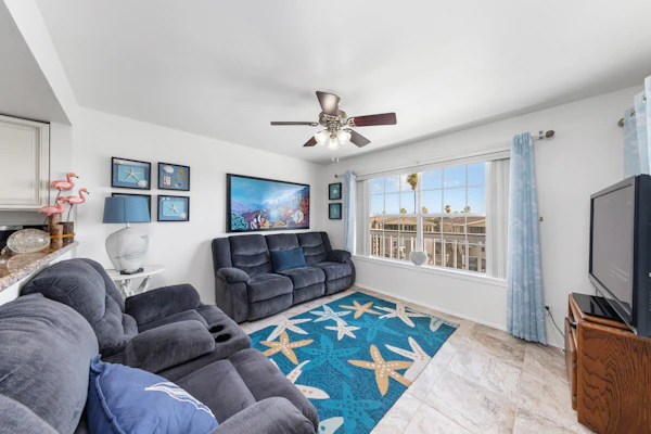 Welcome to Lazy Days Sea Cottage, a two-story canal-front retreat in Port Isabel's gated Long Island Village. Take in the water from the upstairs deck, watch the boats drift along the canal, and gather in a bright, beachy living space with a full kitchen. A king primary suite tops the home, and a family bunk room sleeps the kids, with room for six in all. Resort pools, golf, and tennis are steps away, and South Padre Island beaches are a ten-minute drive over the causeway.