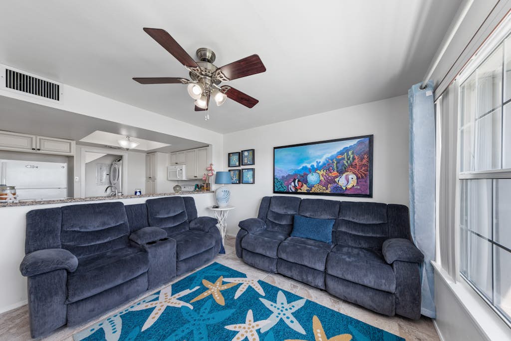 Welcome to Lazy Days Sea Cottage, a two-story canal-front retreat in Port Isabel's gated Long Island Village. Take in the water from the upstairs deck, watch the boats drift along the canal, and gather in a bright, beachy living space with a full kitchen. A king primary suite tops the home, and a family bunk room sleeps the kids, with room for six in all. Resort pools, golf, and tennis are steps away, and South Padre Island beaches are a ten-minute drive over the causeway.