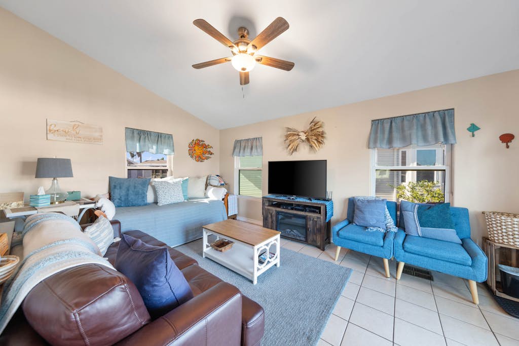 Welcome to Mermaid Manor, a charming waterfront cottage on a quiet canal in the gated Long Island Village resort near Port Isabel. Relax on the covered deck over the water, gather in a bright open living space, and spread out with sleeping for six in a cozy one-bedroom layout. Dive into the resort pools, play the par-3 golf course, or cross the causeway to South Padre Island beaches in minutes. Your easygoing Gulf Coast getaway starts here.