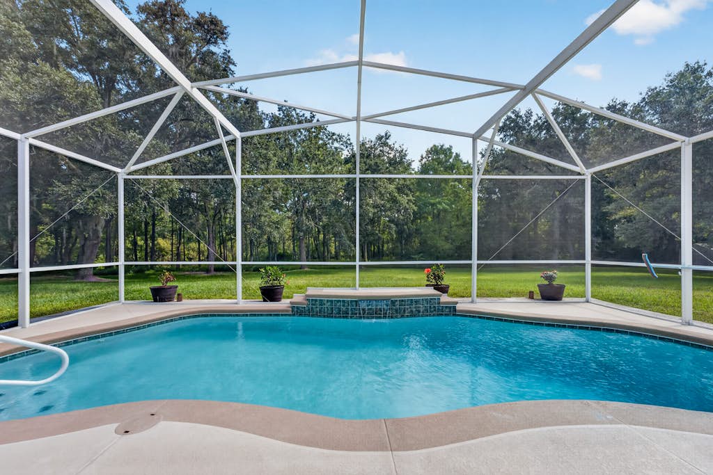 4BR Kissimmee home with private pool, patio, and BBQ.