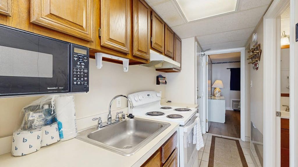 Fifth-floor ocean-view condo with boardwalk views, pool access, washer & dryer, and AC