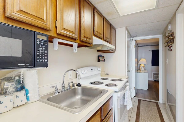 Fifth-floor ocean-view condo with boardwalk views, pool access, washer & dryer, and AC