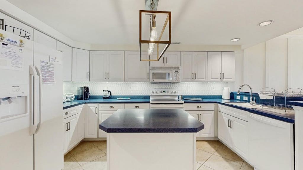 Spacious top-floor beach retreat with pool, fireplace & steps to Northside Park & beach