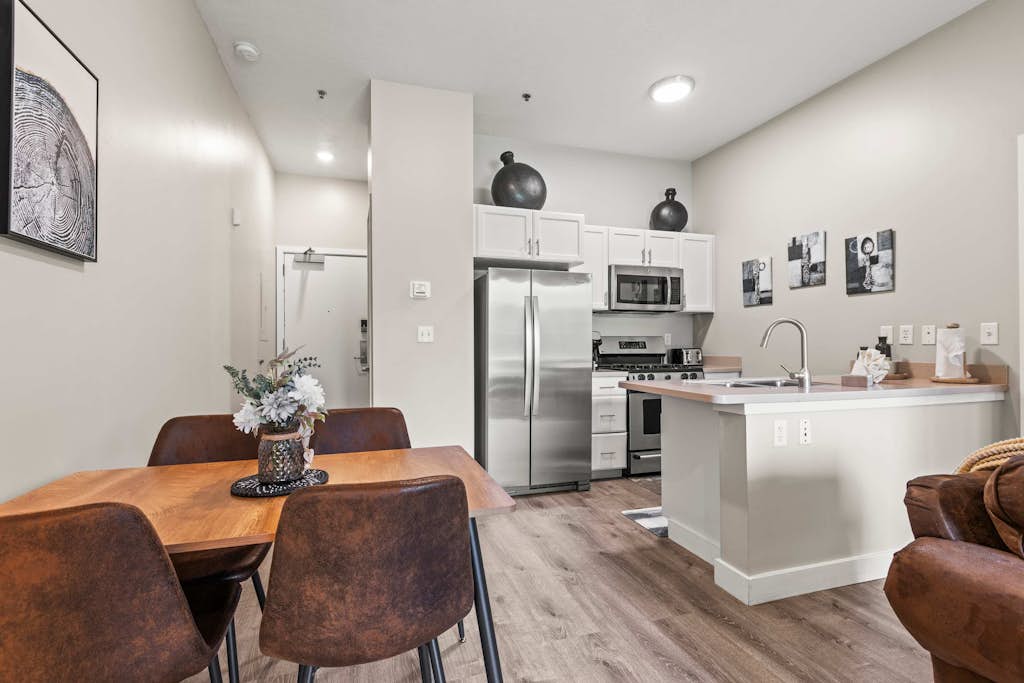 Escape to the perfect mountain getaway in this beautifully furnished 1-bedroom, 2-bathroom condo in Heber City. Thoughtfully designed for comfort and convenience, this rare floor plan offers the privacy of two full bathrooms, making it ideal for couples, small families, business travelers, or friends exploring Utah's Wasatch Mountains.

Relax in the bright, open living area after a day of adventure, prepare meals in the fully equipped kitchen, and unwind in the spacious bedroom featuring plush bedding and ample storage. Whether you're here for a weekend escape or an extended stay, you'll have everything you need to feel right at home.

Located just minutes from Jordanelle Reservoir, Deer Valley East Village, and Park City, you'll enjoy easy access to world-class skiing, hiking, mountain biking, boating, golf, and year-round outdoor recreation. Historic Main Street Park City, local restaurants, shopping, and the charm of downtown Heber are all just a short drive away.

Highlights
Rare 1 bedroom, 2 full bathroom layout
Cozy fireplace for relaxing evenings
Fully equipped kitchen
Comfortable open-concept living area
On-Site Pool & Fitness Center
High-speed Wi-Fi
Minutes from Deer Valley, Park City and Jordanelle Reservoir
Perfect for vacations, remote work, or extended stays

Whether you're chasing powder in the winter, lake days in the summer, or colorful mountain scenery in the fall, this inviting condo is the perfect home base for making unforgettable memories in every season.