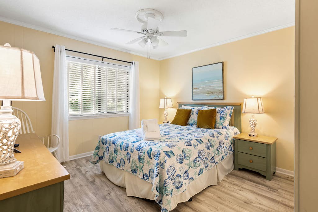 Enjoy a relaxing Hilton Head Island getaway in this comfortable two-bedroom villa at Hilton Head Island Beach and Tennis Resort. Located on the first floor of Building B, this villa features a private furnished balcony with lagoon views, a full kitchen, two full bathrooms, and accommodations for up to six guests. Spend your days at the beach, lounging by the oceanfront pool, or enjoying the resort's tennis courts, pickleball, dining, and family-friendly amenities.