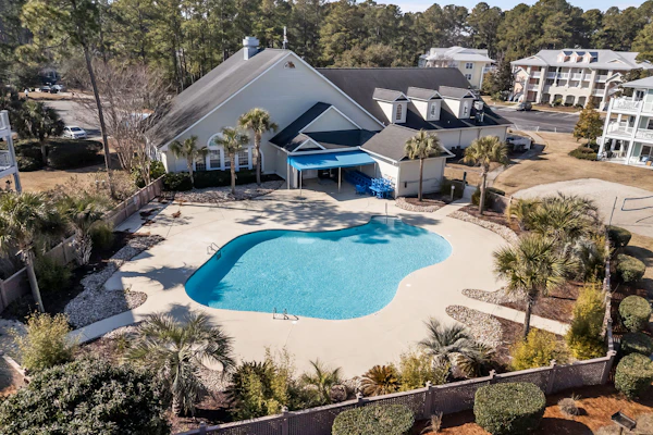 Coastal Golf Course Condo – Shared outdoor pool and fitness center
