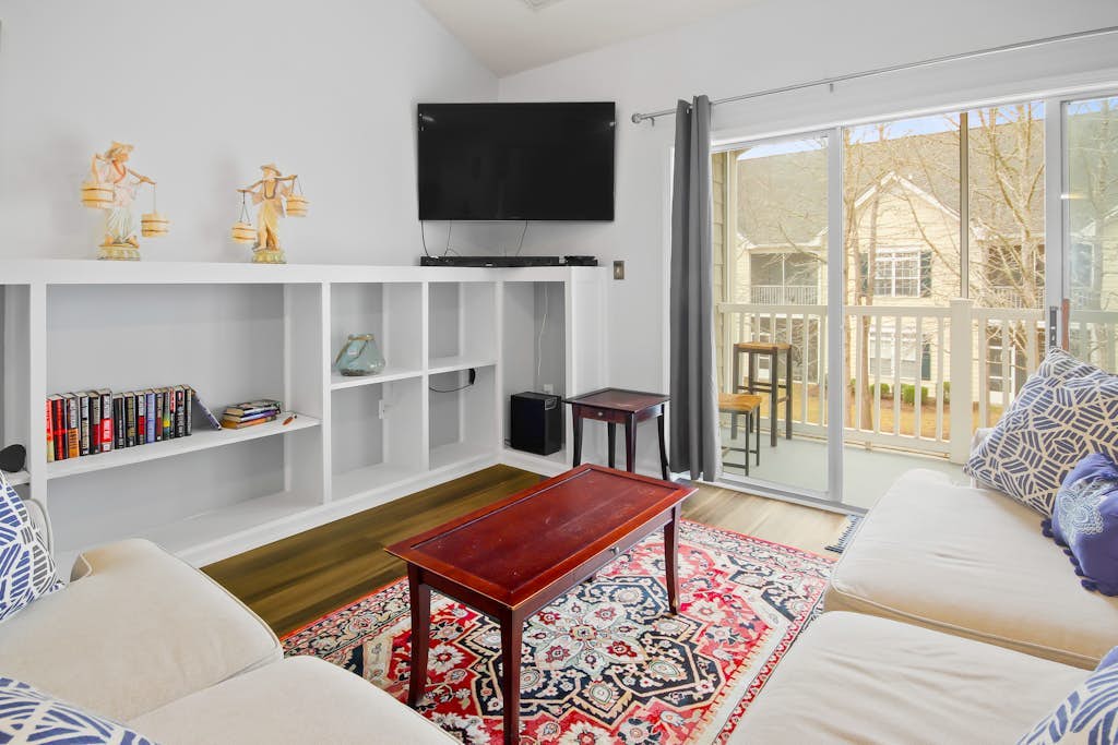 Tasteful condo with a large balcony, washer/dryer, & AC - pool and grill access