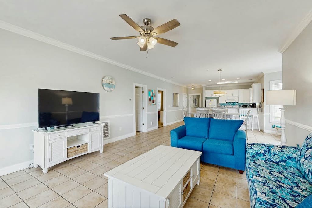 Lakefront condo near beach with water views, pool, golf, balcony, clubhouse, AC