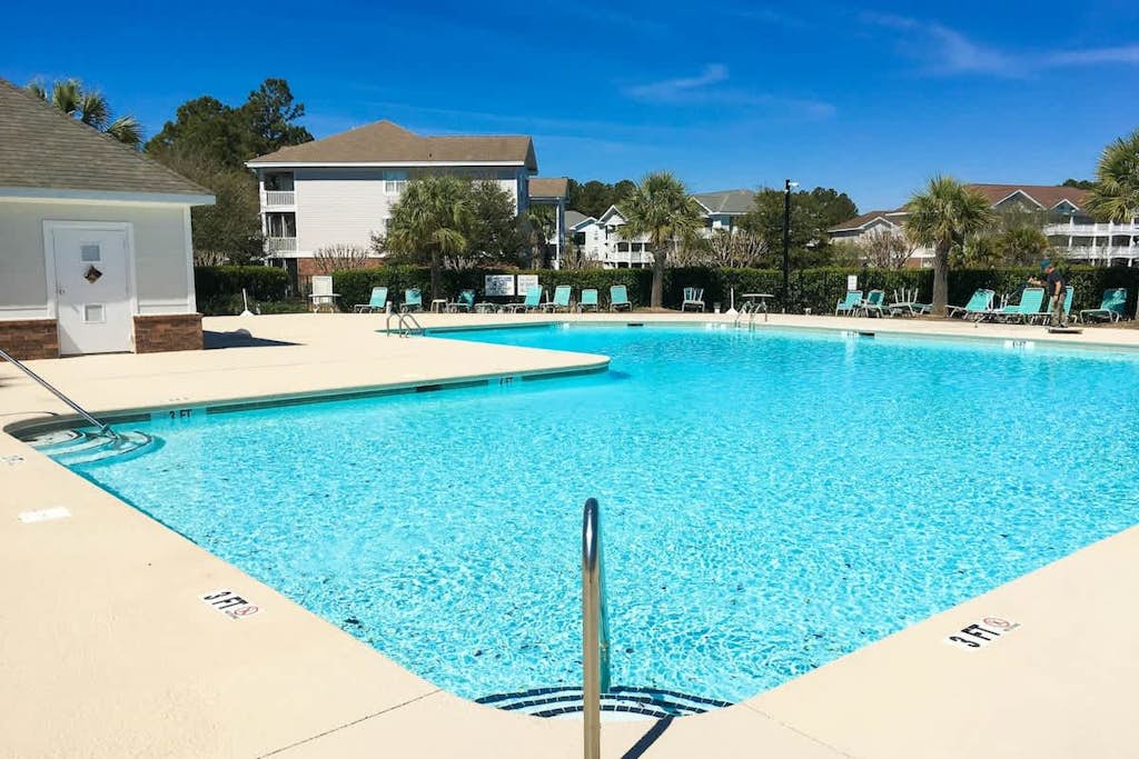 Resort home with screened balcony, pools, hot tub, golf courses, & beach shuttle