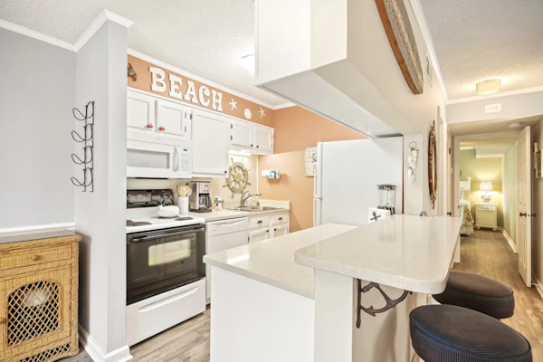 Serene condo with a pool view, screened balcony, washer/dryer, & central AC