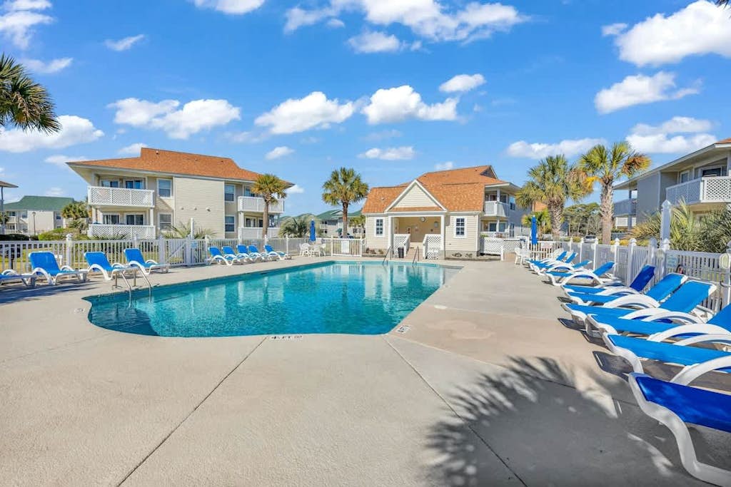 Pool view condo with balcony, pool, hot tub & steps to beach