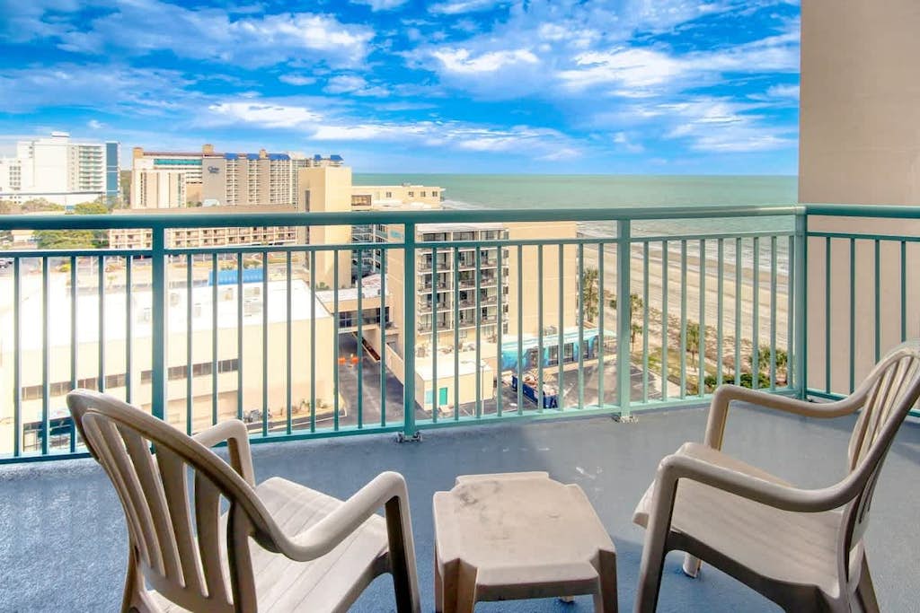 Oceanfront condo with wraparound balcony, pools, gym, & washer/dryer