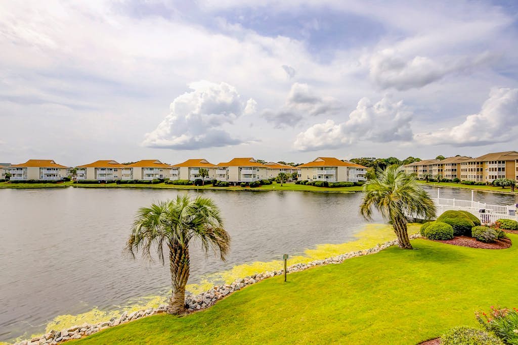 Water-view condo with outdoor pool, balcony, AC, close to Ocean