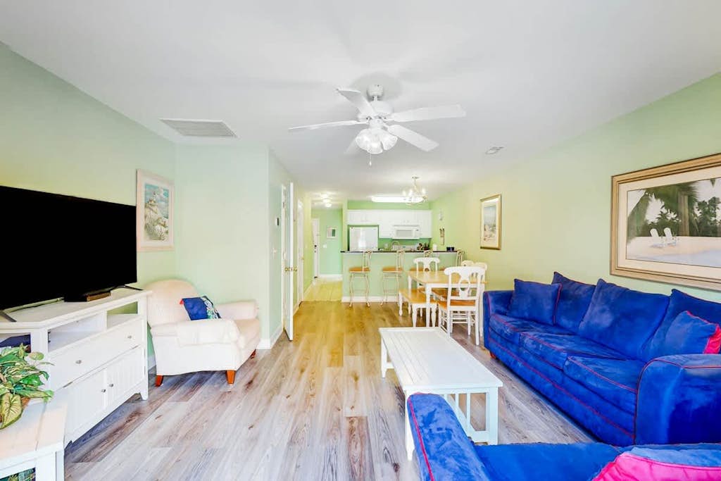Dog-friendly townhome steps from the sand with private patio, central AC, & W/D