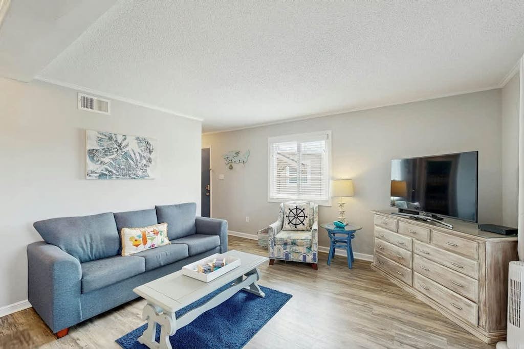 Inviting 3rd floor condo with pool, central AC, & Washer/Dryer