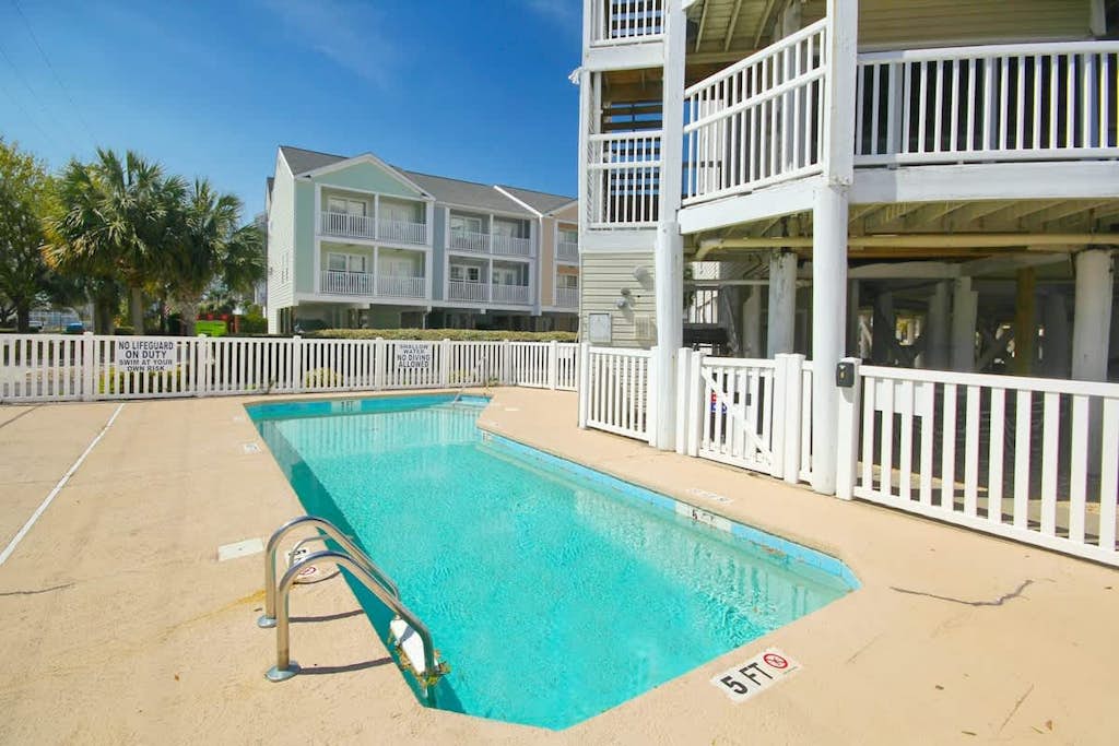Updated condo with water views, pool, well-equipped kitchen, & deck