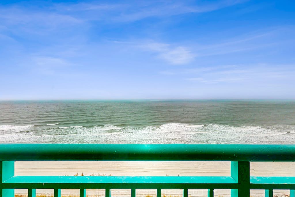 Oceanfront studio with private balcony, A/C, & beach access