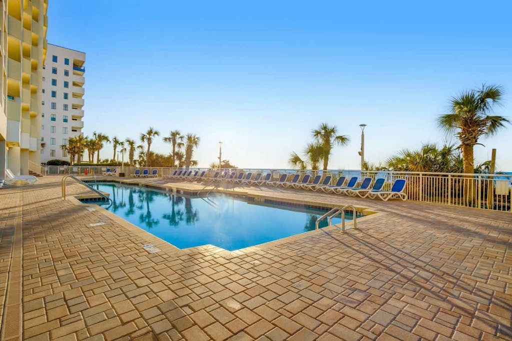 Oceanfront condo with shared pool, hot tub, fitness room, central AC, & balcony